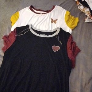 Two "No Boundaries" shirts